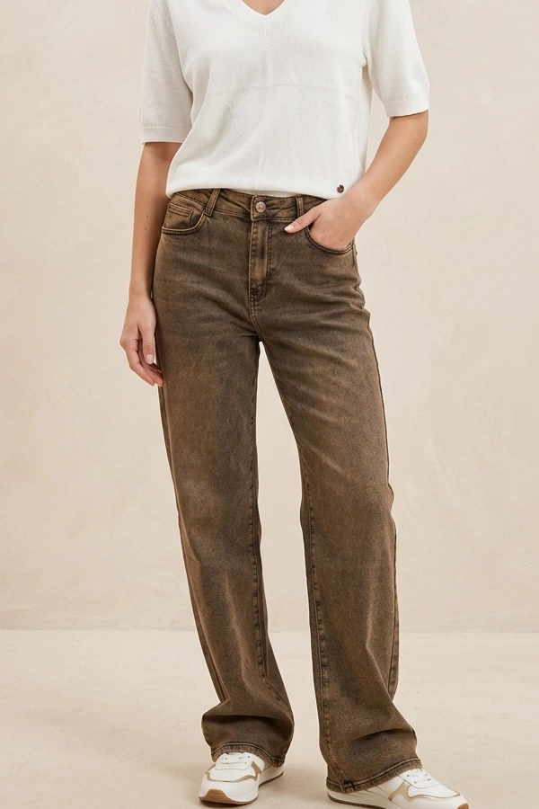 Full-length view of women's brown wide leg jeans