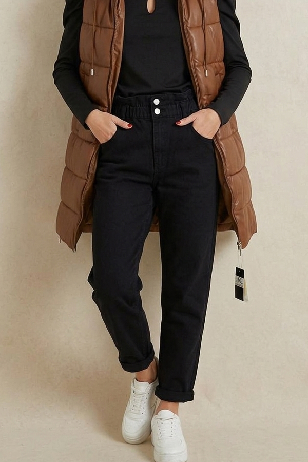 Black high-waist balloon fit jeans styled with a brown puffer vest