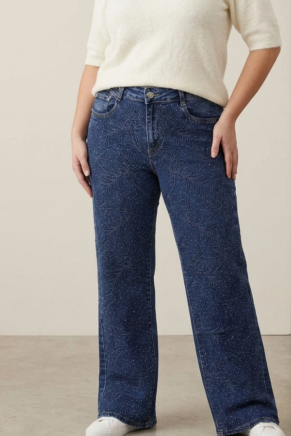 Woman wearing floral rhinestone wide-leg jeans
