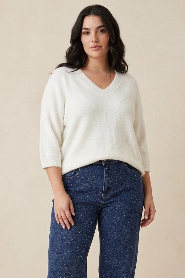 Woman wearing a soft white mohair V-neck sweater
